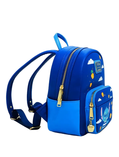 A blue mini backpack with a matching zippered pouch, featuring gold-tone hardware, white cloud prints, and character graphics on a clean white background.