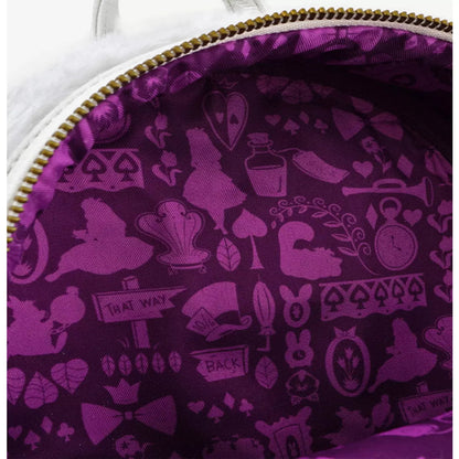 Close-up of a purple interior lining with Alice in Wonderland-themed designs on a white bag.