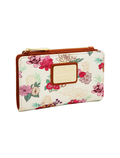 A Disney wallet featuring a cream-colored faux leather body with a vibrant pink, red, and green floral print, brown leather trim, and a gold-tone zipper.