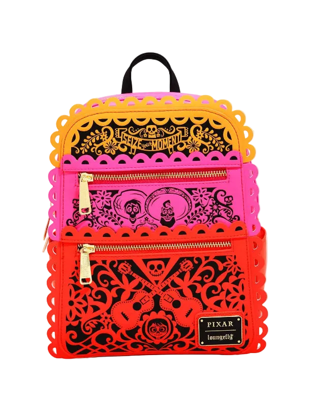 Backpack with colorful cut-out designs on a white background