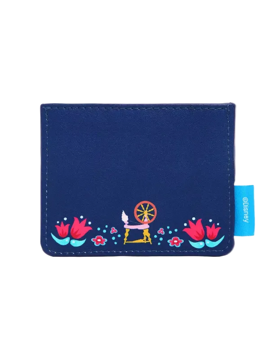 A navy blue wallet with a colorful embroidered design of a spinning wheel, flowers, and dots along the bottom, featuring a light blue 'glittery' brand tag on the right side.
