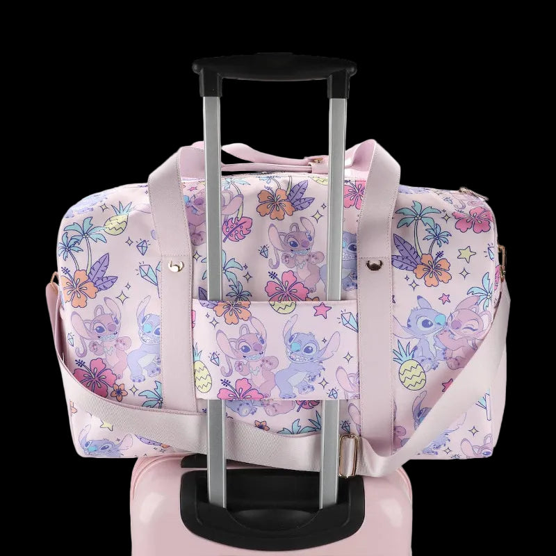 Pink duffel bag with cartoon character and floral pattern on a white background