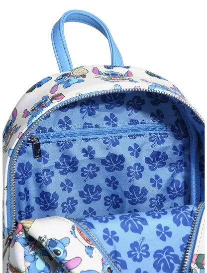 A close-up of a backpack showing its interior and exterior details. The exterior features a white fabric printed with cartoon characters, and the interior is lined with light blue fabric patterned with dark blue hibiscus flowers.
