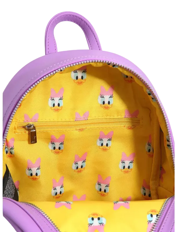 Backpack with yellow interior and pink exterior, featuring a cartoon character pattern.