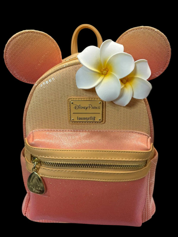 Pink backpack with mouse ears and a flower on a black background
