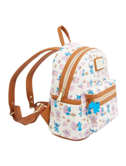 A small white backpack with a colorful cartoon character print, brown faux-leather trim, and gold-tone zippers, shown on a clean white background.