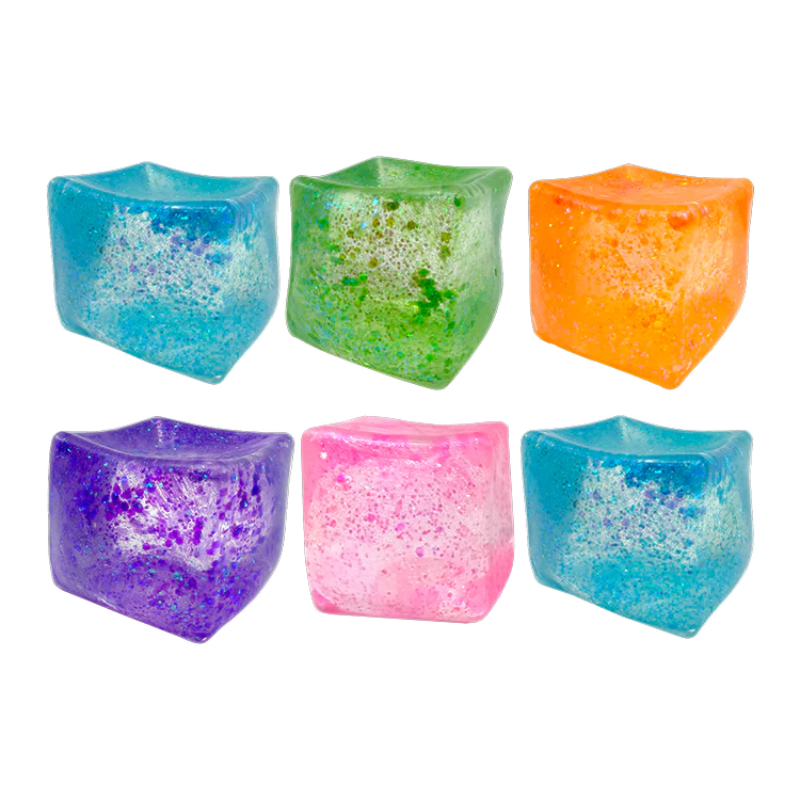 Set of colorful ice cube-shaped candle holders on a white background
