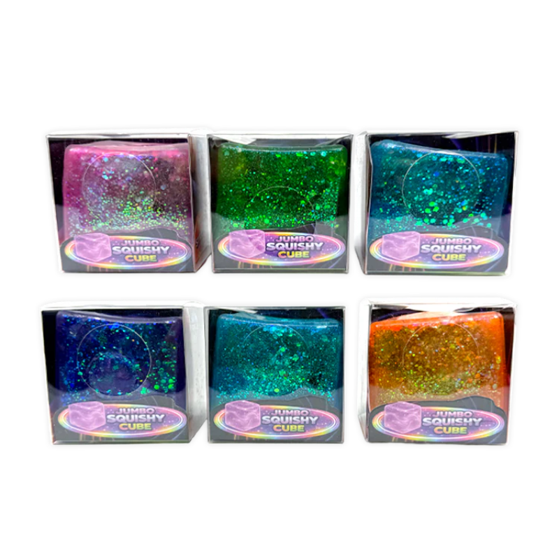 Six colorful glittery cubes in packaging on a white background
