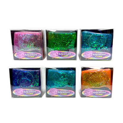 Six colorful glittery cubes in packaging on a white background