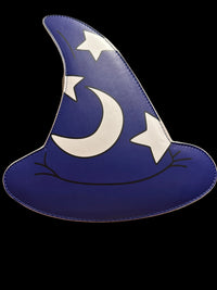 A blue wizard hat shaped wall plaque or decor piece with a white crescent moon and stars, displayed on a cardboard box against a beige wall.