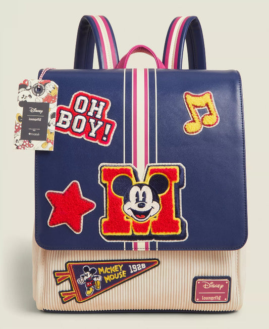 Backpack with Mickey Mouse patches and 'OH BOY!' text on a beige background