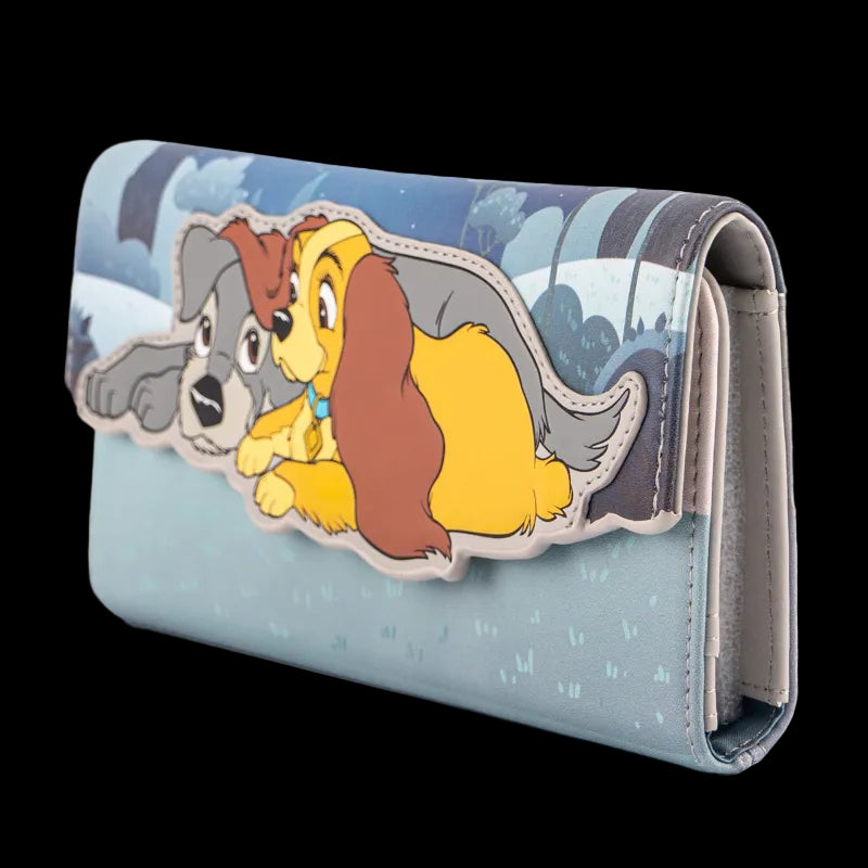 A light blue wallet featuring a raised cartoon applique of two dogs, one gray and one yellow-brown, on a plain white background.