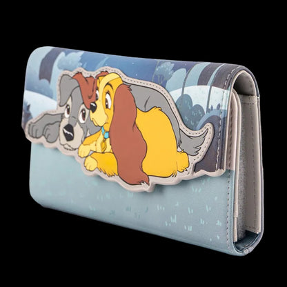 A light blue wallet featuring a raised cartoon applique of two dogs, one gray and one yellow-brown, on a plain white background.