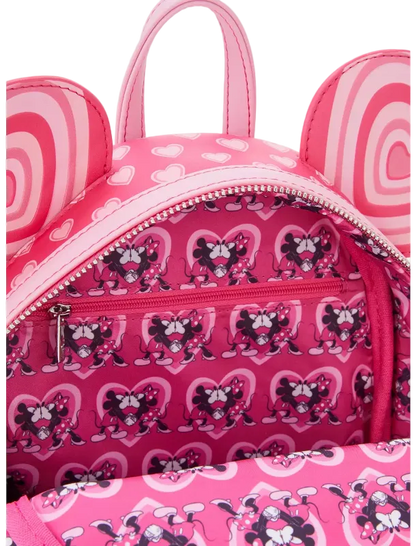 Pink backpack with cartoon character pattern on a white background
