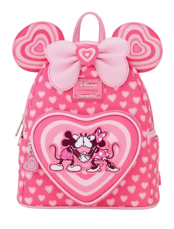 Pink backpack with heart design and Minnie Mouse illustration on a white background
