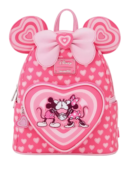 Pink backpack with heart design and Minnie Mouse illustration on a white background