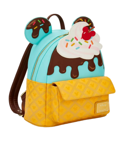 Backpack designed like a ice cream sundae with a cherry on top, chocolate sauce, and waffle cone base.