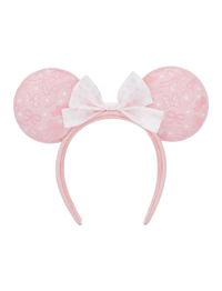 A pink and white Minnie Mouse-themed headband with round ears featuring a subtle bow pattern and a central white bow with pink polka dots, shown against a plain white background.