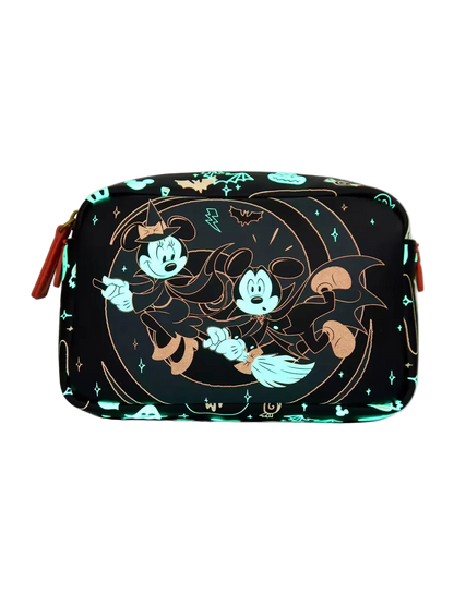 A rectangular cosmetic pouch featuring a Halloween-themed Mickey and Minnie Mouse print on a black background, with glowing teal and gold accents, shown on a light gray studio background.