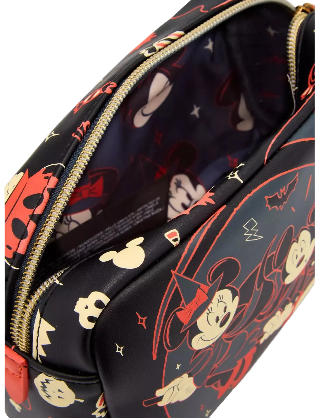 A close-up of a black zippered cosmetic pouch featuring a colorful cartoon character print in red, beige, and white, with a gold zipper.