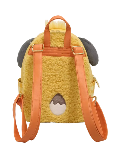 A yellow sherpa dog backpack with orange straps, gray ears, and a brown and cream patch on the back, shown against a light gray background.