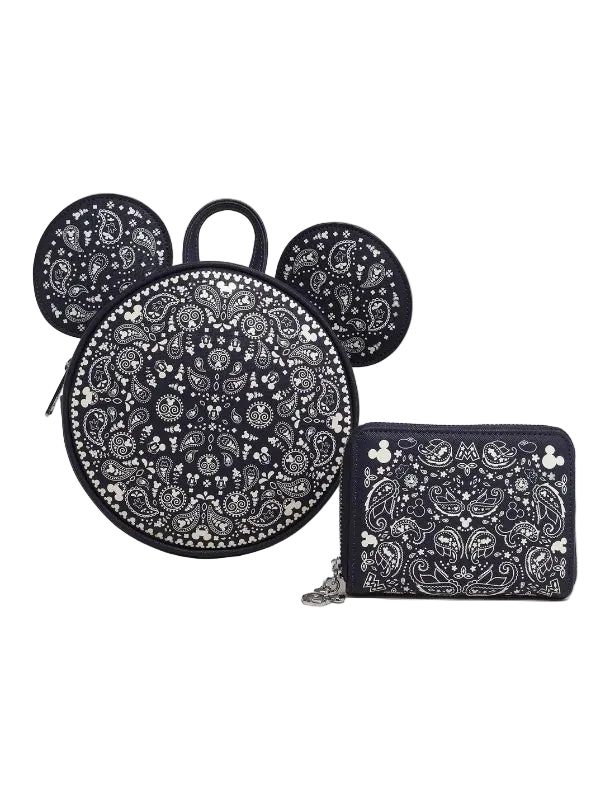 Black and white patterned backpack with matching pouch on a white background