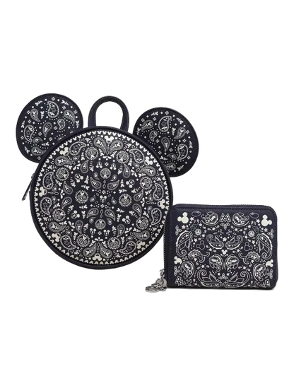 Black and white patterned backpack with matching pouch on a white background