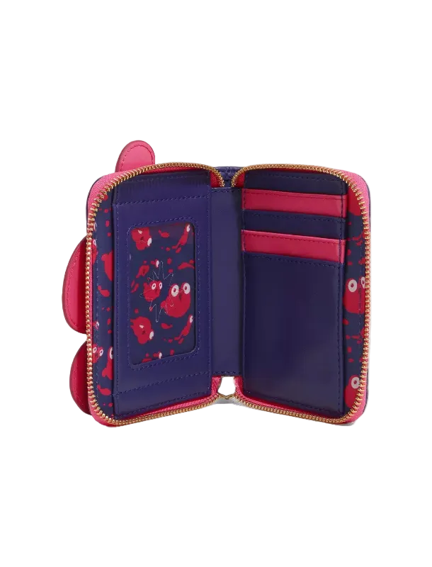 An open zip-around wallet with a pink and navy patterned interior, featuring card slots, an ID window, and a small side loop, photographed on a clean white background.
