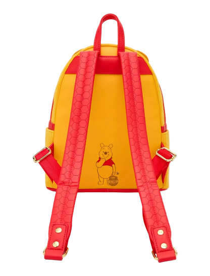 Yellow backpack with red straps featuring a bear illustration on a white background