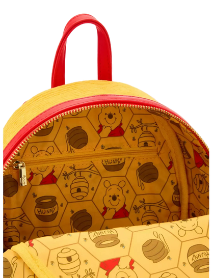 Yellow backpack with red zipper and Winnie the Pooh pattern on a white background