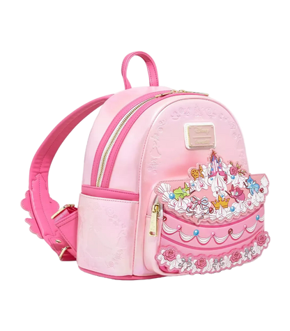 Pink backpack with a decorative cake design on a white background
