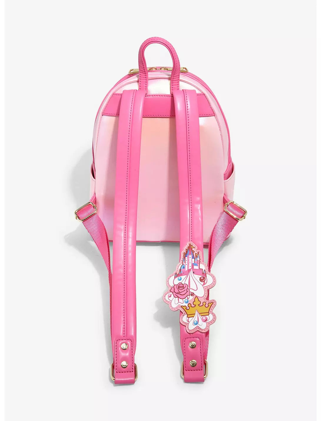 Pink backpack with a decorative strap on a white background