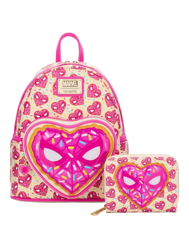 Pink backpack with heart-shaped spider face design on a white background