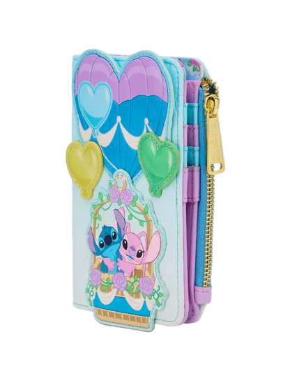 A light blue zip-around wallet featuring Stitch and Angel from Lilo & Stitch, decorated with purple and blue hot air balloons, heart-shaped charms, and a gold zipper.
