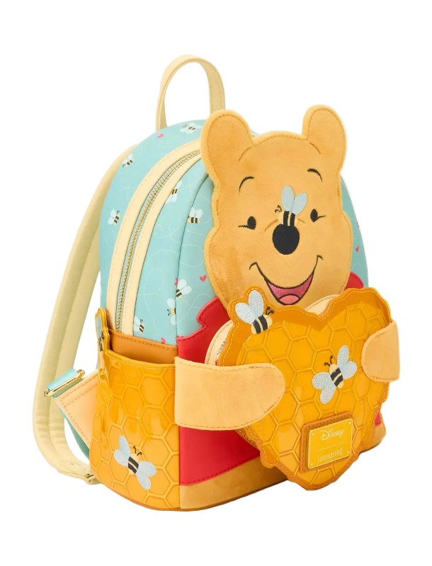 Backpack with a cartoon bear design holding a honeycomb, on a light gray background