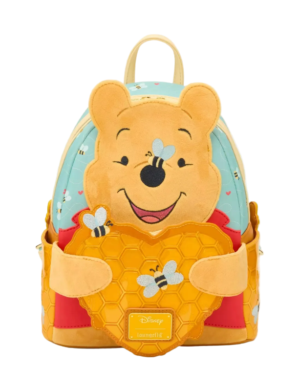 Backpack designed like a bear character with honeycomb and bee details on a white background