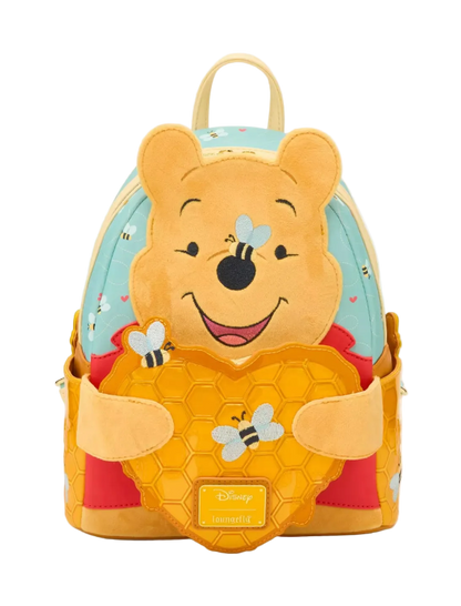 Backpack designed like a bear character with honeycomb and bee details on a white background
