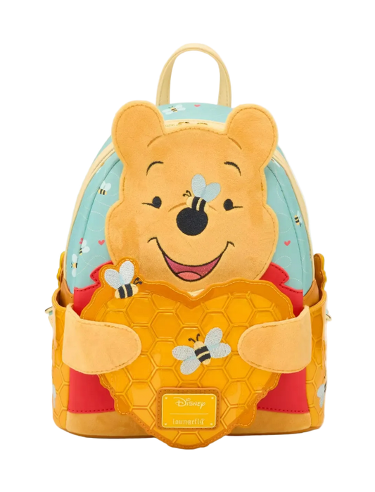 Backpack designed like a bear character with honeycomb and bee details on a white background