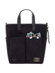 Black tote bag with character design and Disney logo on a white background