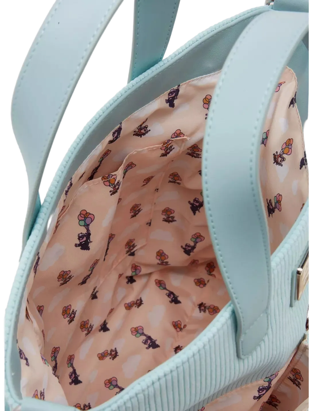 Light blue handbag with a patterned interior on a light background
