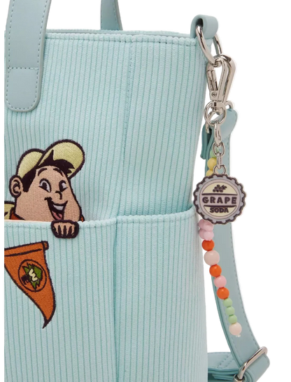 Light blue corduroy bag with cartoon character and colorful strap on a white background