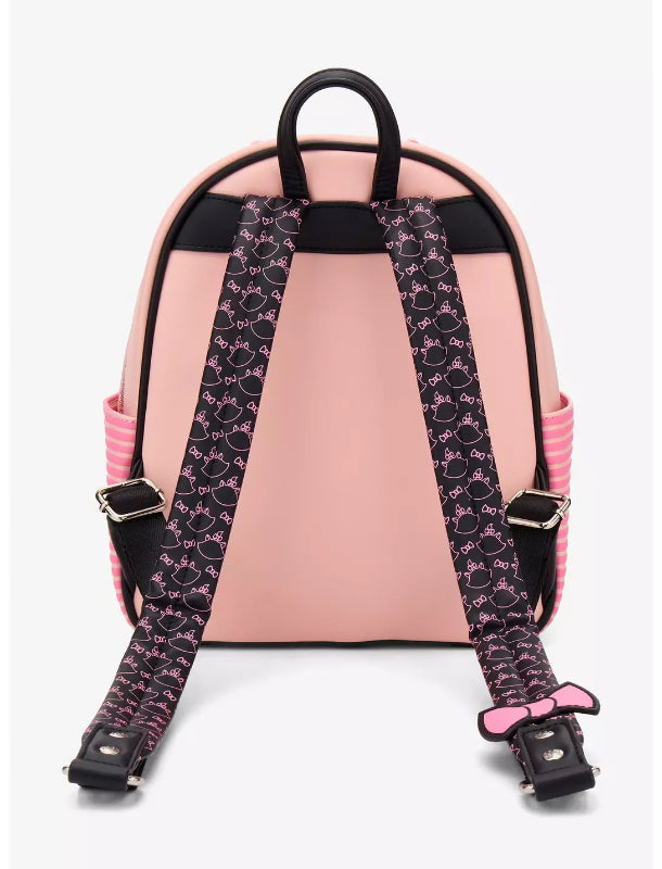 Pink backpack with a patterned strap on a white background