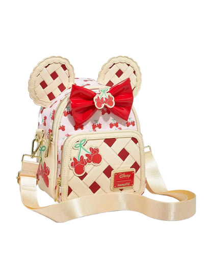 Crossbody bag with cherry pie design and bow on a white background