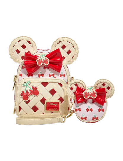 Disney-themed bag and coin purse with red bows and cherry designs on a white background