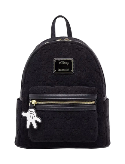Black backpack with gold zipper and Mickey Mouse charm on a white background