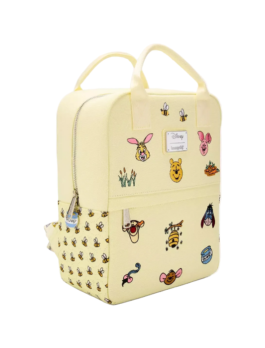 Yellow backpack with various cartoon character stickers on a white background