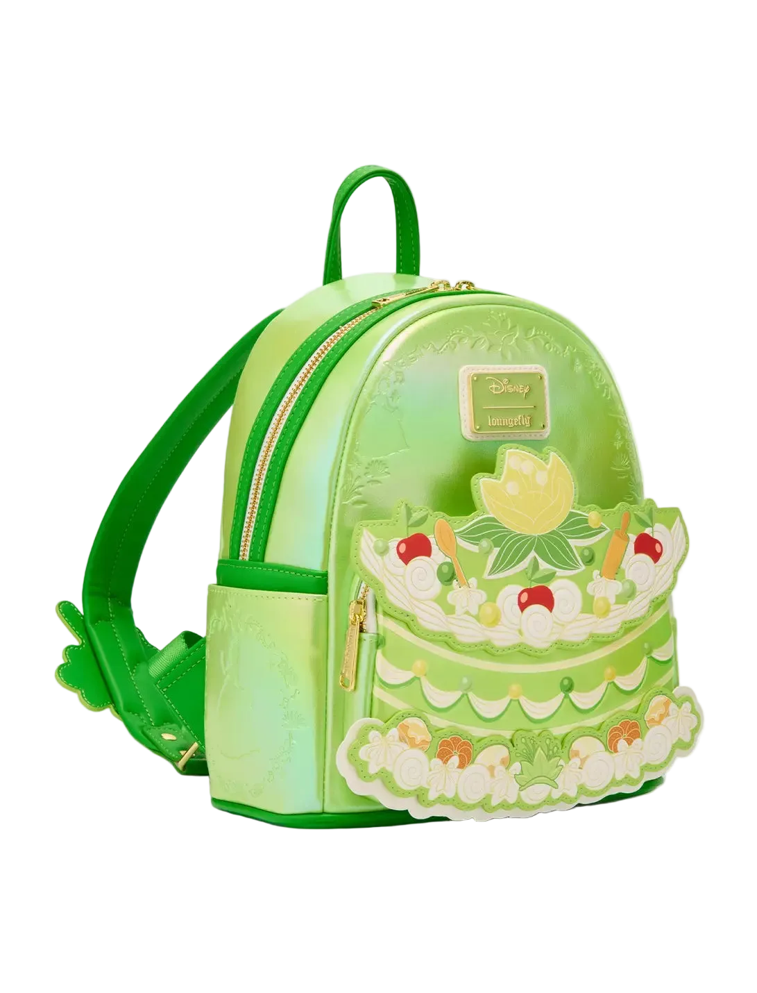 Green cake-shaped backpack with decorative elements on a white background