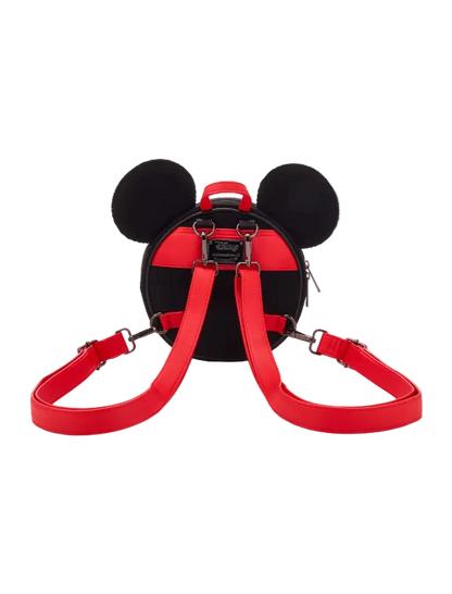 A red and black Mickey Mouse-shaped backpack with black ears and a red shoulder strap, shown from the back on a light gray background.