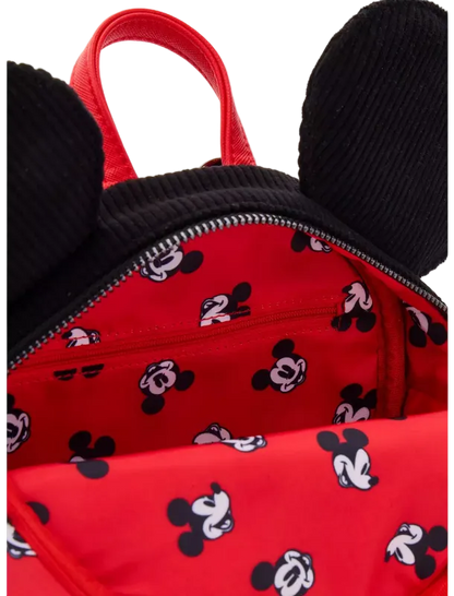 Close-up of a red backpack with black mouse ears and a black-and-white Mickey Mouse face print on the interior and exterior.