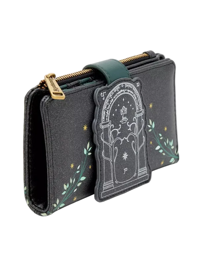 A black faux-leather zip-around wallet featuring a green leather strap, gold zipper pulls, and a decorative front patch depicting a tombstone with stars and green leafy vines.